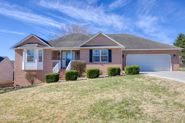 ranch-style home featuring brick siding, a shingled roof, a front lawn, concrete driveway, and an attached garage