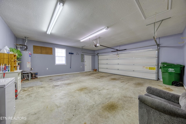 garage featuring electric panel, a garage door opener, and water heater