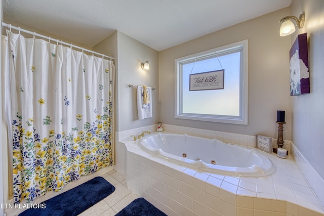 full bath with a shower with shower curtain, a whirlpool tub, and tile patterned flooring