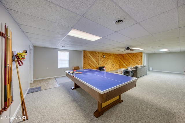 playroom featuring visible vents, baseboards, light colored carpet, wood walls, and a paneled ceiling