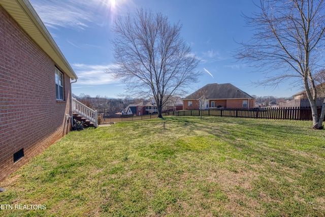 view of yard featuring a fenced backyard