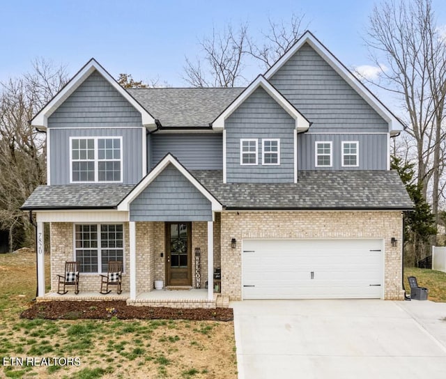 view of front of home featuring brick siding, board and batten siding, covered porch, a garage, and driveway