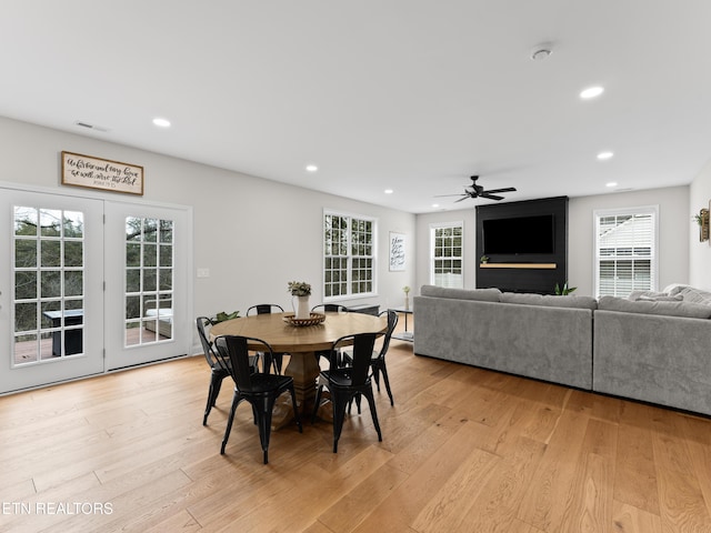 dining area with light wood finished floors, recessed lighting, and a ceiling fan