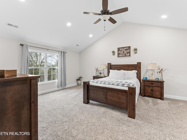 bedroom featuring visible vents, lofted ceiling, light colored carpet, and baseboards