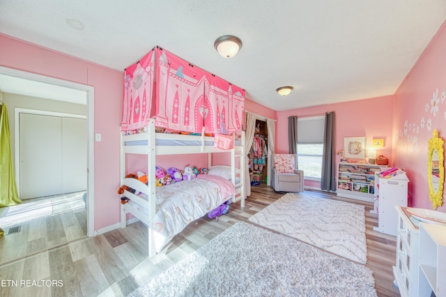 bedroom with wood finished floors