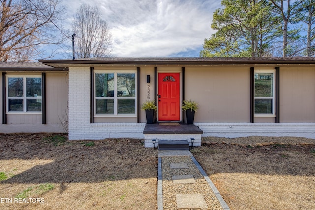 view of front of property featuring brick siding