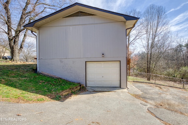 garage featuring aphalt driveway