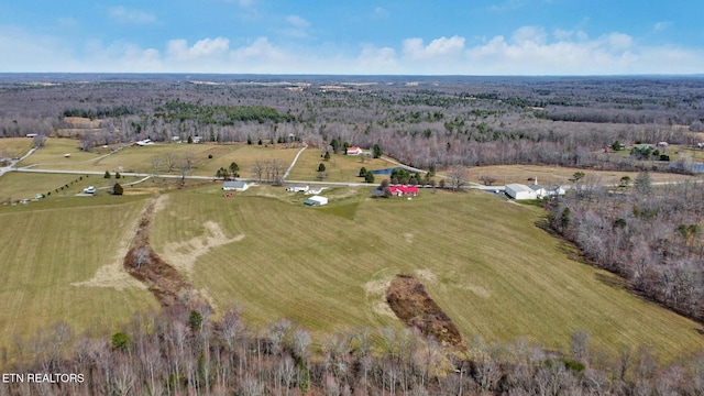 birds eye view of property with a rural view