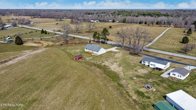 birds eye view of property featuring a rural view