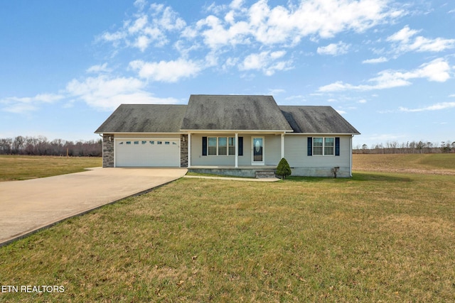 view of front of home with stone siding, driveway, a front yard, and a garage