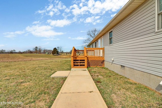 view of yard with a wooden deck