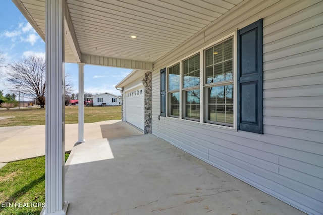 view of patio / terrace with driveway