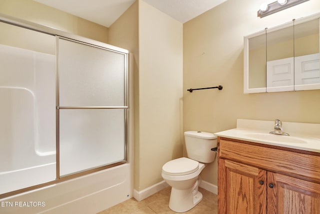 full bathroom featuring vanity, baseboards, enclosed tub / shower combo, tile patterned flooring, and toilet