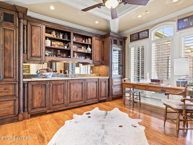 office area with light wood finished floors, coffered ceiling, crown molding, and a ceiling fan