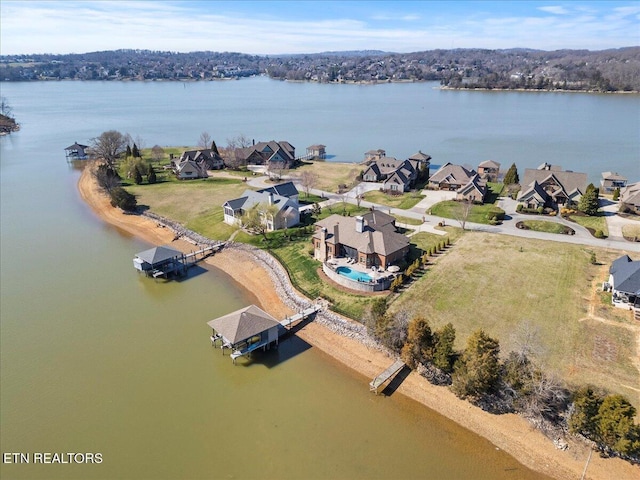 birds eye view of property with a residential view and a water view