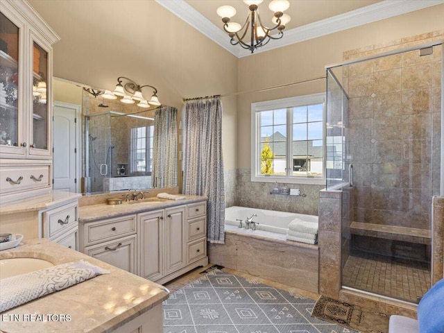 full bath with vanity, an inviting chandelier, a shower stall, crown molding, and a bath