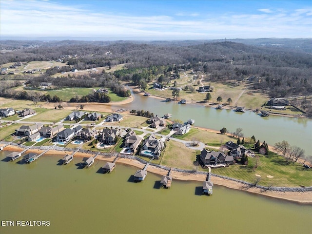 aerial view with a residential view and a water view