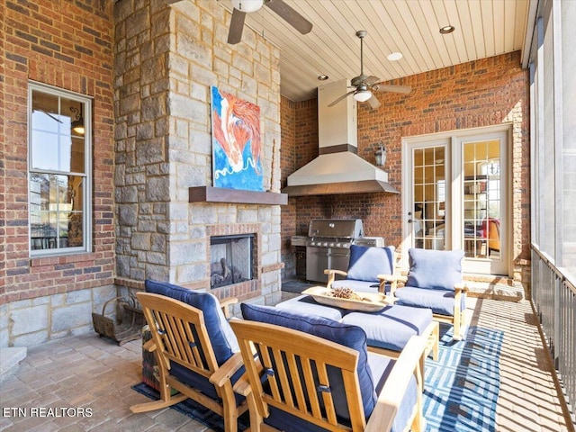 view of patio featuring an outdoor living space with a fireplace and grilling area