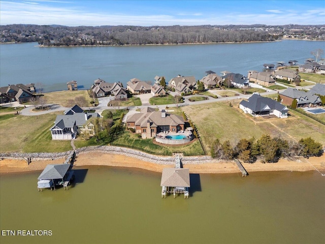 bird's eye view featuring a residential view and a water view