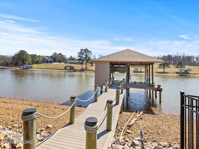 dock area featuring a water view and boat lift