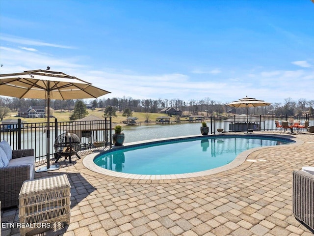 view of pool with a fenced in pool, central air condition unit, fence, and a patio area