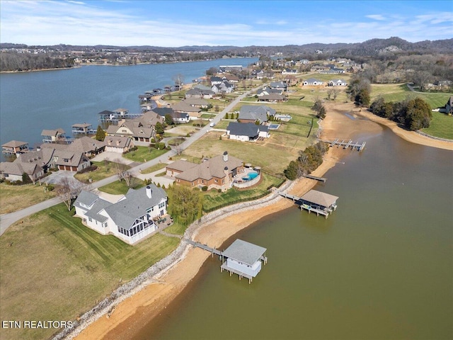 birds eye view of property featuring a residential view and a water view