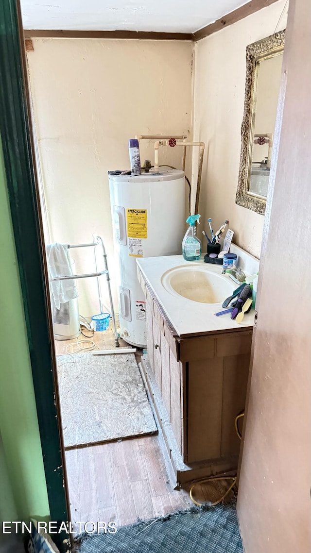 234 Habersham Rd, Duff, TN 37729 - bathroom with electric water heater, vanity, and wood finished floors