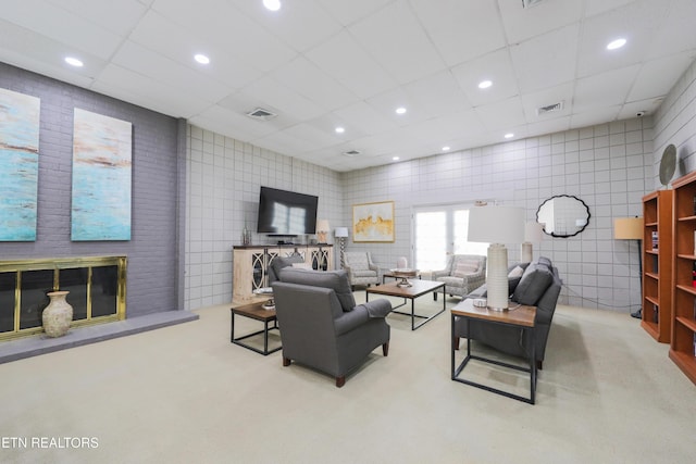 living area featuring recessed lighting, visible vents, a paneled ceiling, and carpet flooring