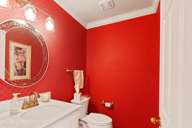 bathroom featuring visible vents, wallpapered walls, toilet, ornamental molding, and vanity