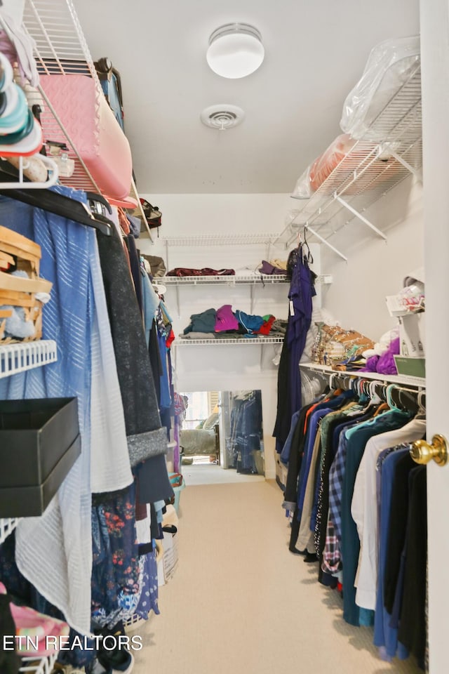 walk in closet with carpet flooring and visible vents