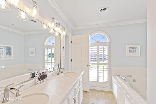 bathroom featuring crown molding, visible vents, and a sink