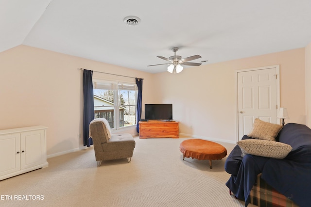 carpeted living room featuring a ceiling fan, lofted ceiling, baseboards, and visible vents