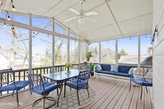 sunroom / solarium with vaulted ceiling and ceiling fan