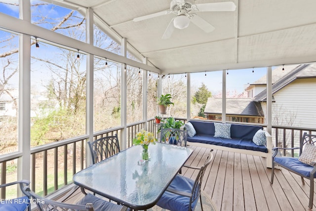 sunroom / solarium featuring ceiling fan and vaulted ceiling