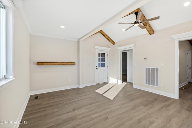 unfurnished living room featuring lofted ceiling with beams, visible vents, wood finished floors, and ceiling fan