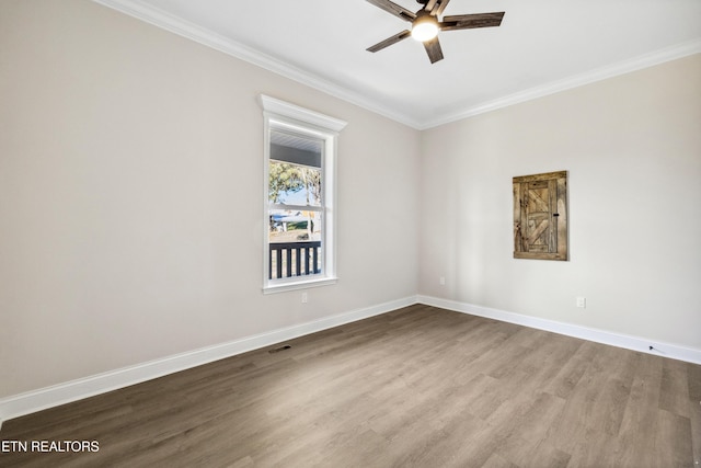 unfurnished room featuring a ceiling fan, baseboards, and ornamental molding