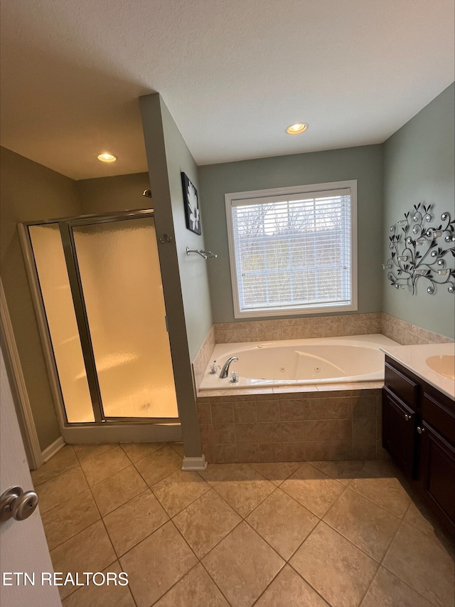 full bath with tile patterned floors, a shower stall, vanity, and a whirlpool tub