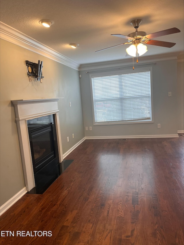 unfurnished living room with baseboards, a fireplace with flush hearth, dark wood-type flooring, and ornamental molding