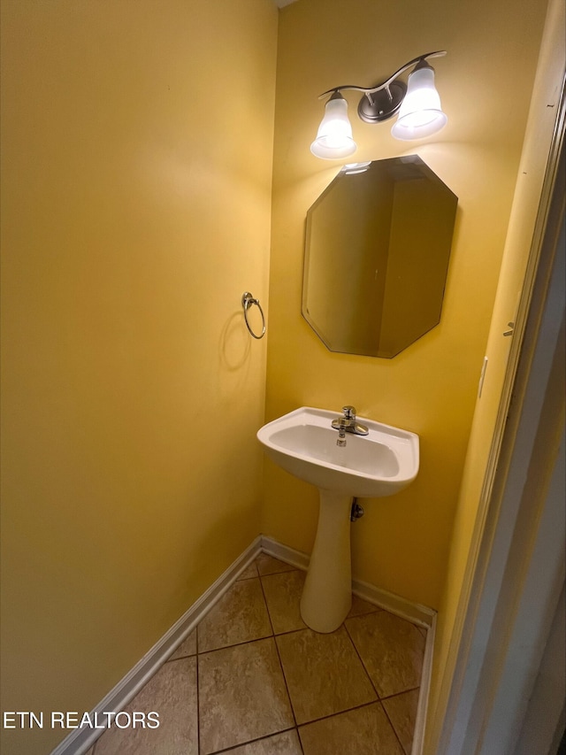 bathroom with tile patterned flooring and baseboards