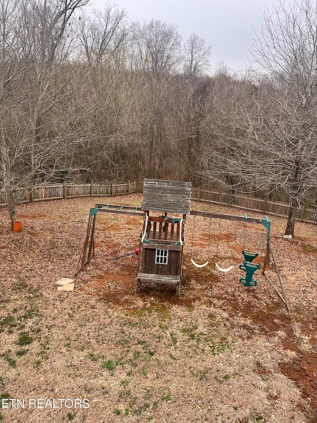 view of home's community with fence