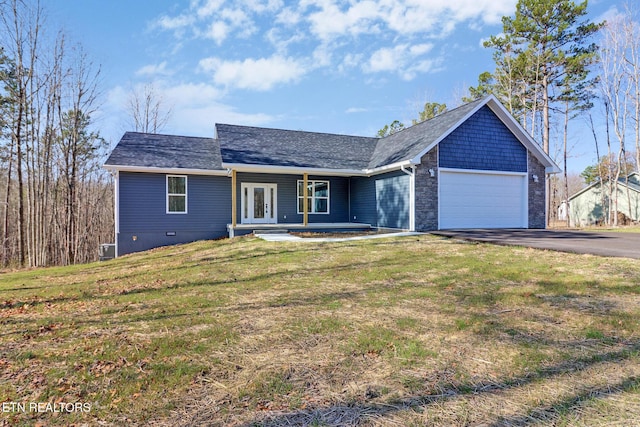 single story home with covered porch, a front lawn, french doors, a garage, and aphalt driveway