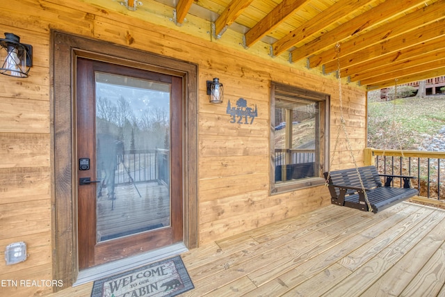 doorway to property with a porch