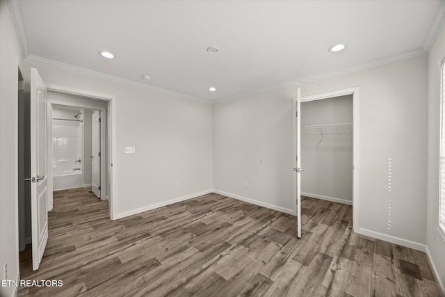 1600 Anna Maria Ln, Cookeville, TN 38501 - unfurnished bedroom with wood finished floors, recessed lighting, baseboards, a closet, and crown molding