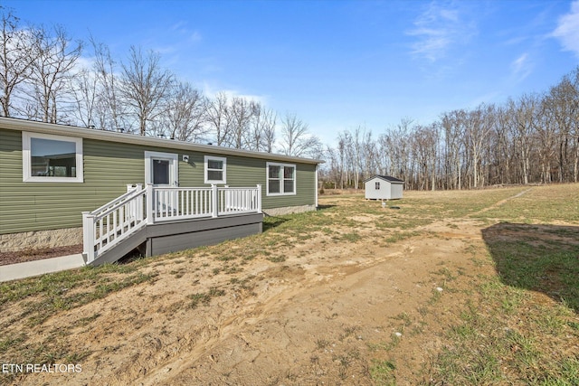 1600 Anna Maria Ln, Cookeville, TN 38501 - view of front of property with a storage unit, a deck, and an outdoor structure