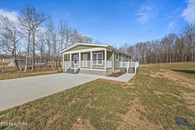 1600 Anna Maria Ln, Cookeville, TN 38501 - view of front of property with covered porch, crawl space, a front yard, and driveway