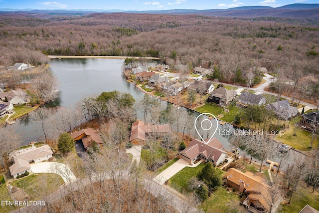 drone / aerial view featuring a water view and a residential view