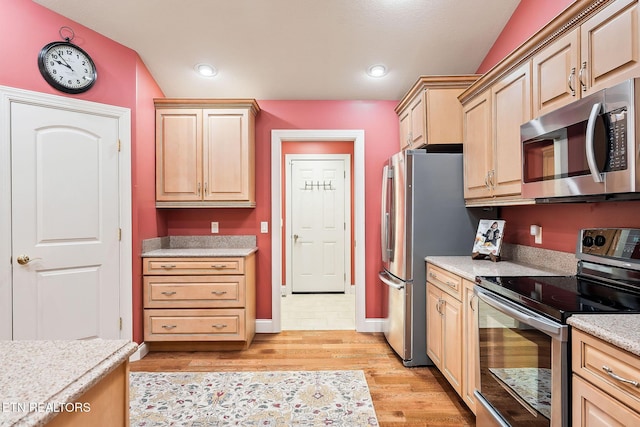 kitchen featuring baseboards, light wood-style flooring, recessed lighting, light brown cabinetry, and stainless steel appliances