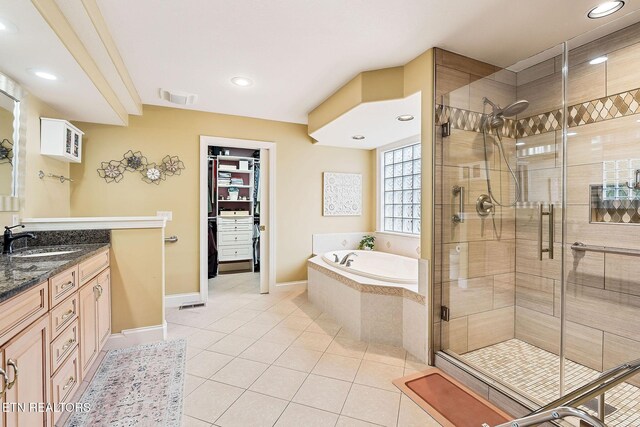 full bath with visible vents, a garden tub, a stall shower, and tile patterned flooring