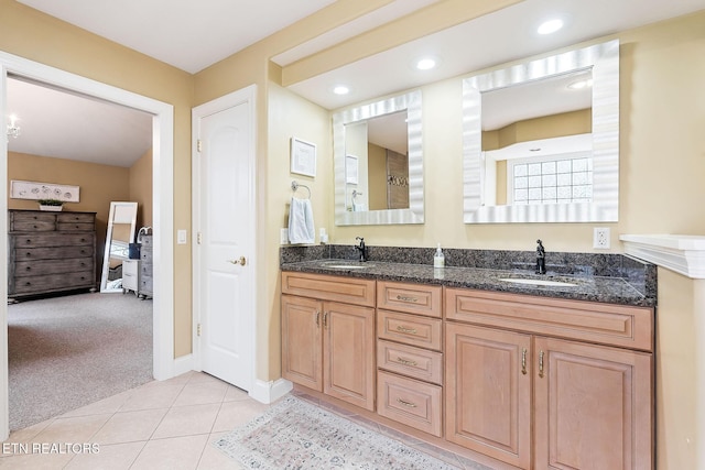 full bathroom with a sink, double vanity, recessed lighting, and tile patterned floors