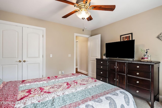 bedroom featuring a closet, baseboards, and a ceiling fan